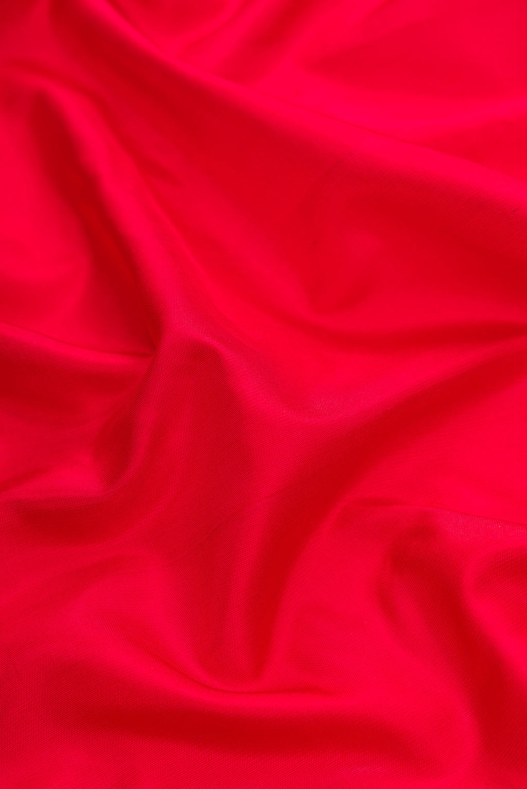 Close up of Red Dual Tone Gadwal Silk Saree with Plain Body and Temple Border.  displaying folds