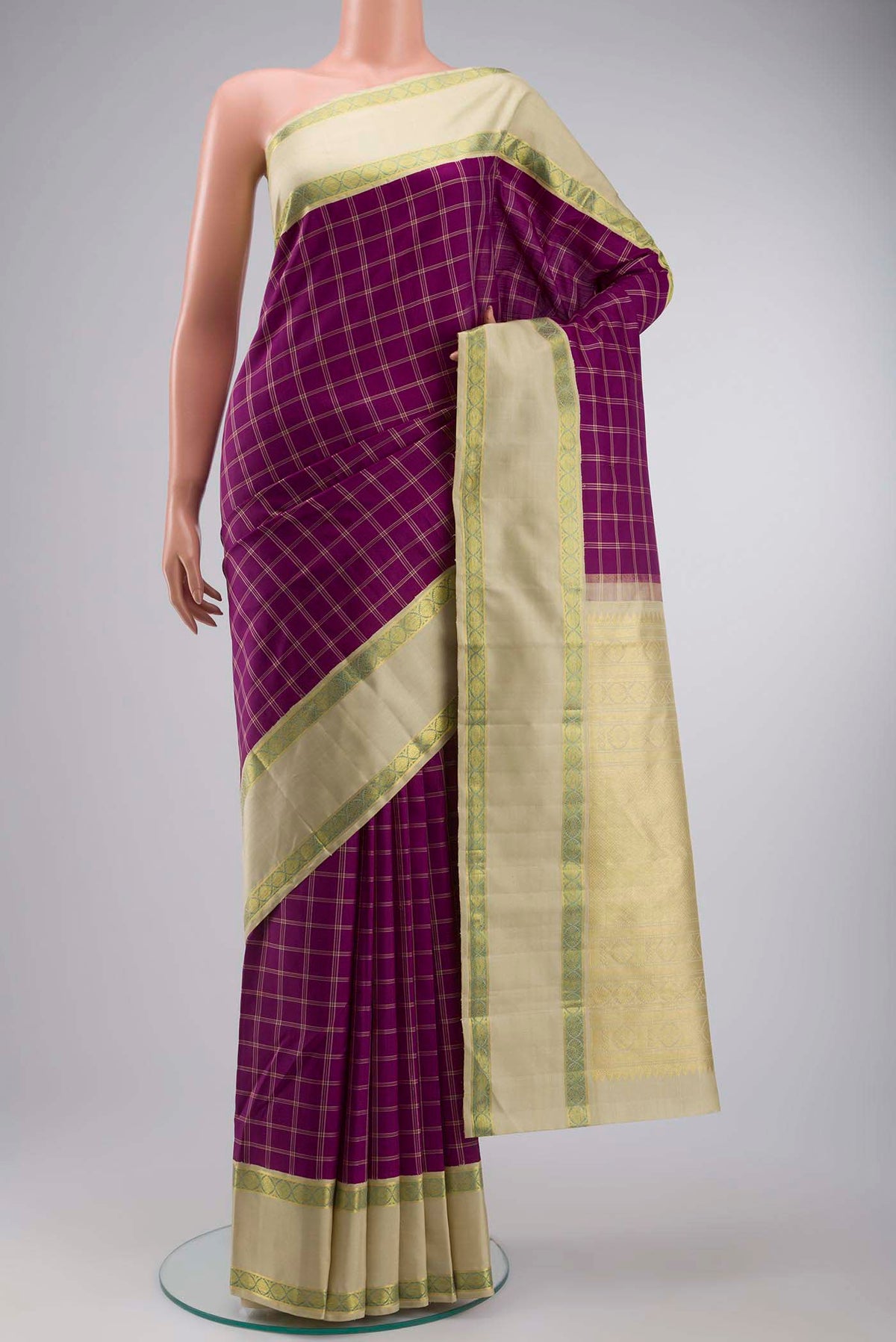 Purple Kanchipuram Silk Saree with Checked design on the body and Zari Border displayed on a mannequin