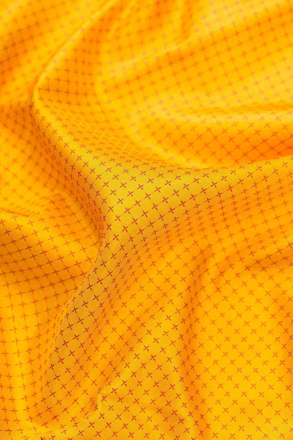 Close up of Pure Silk Pure Zari Yellow Dual Tone Kanjivaram Saree with Thread Butta on the body and Zari Border.  displaying folds