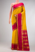 Pure Silk Pure Zari Yellow Dual Tone Kanjivaram Saree with Thread Butta on the body and Zari Border.  displayed on a mannequin
