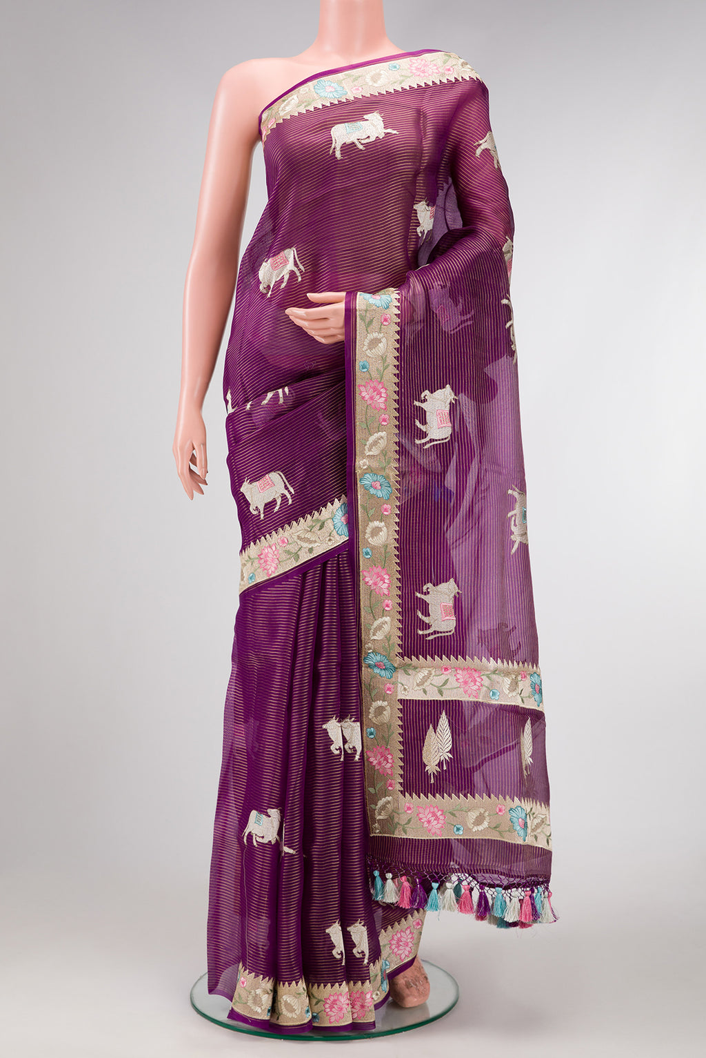 Purple Dual Tone Organza Silk Saree with Embroidery on the body and Embroidery Border.  displayed on a mannequin