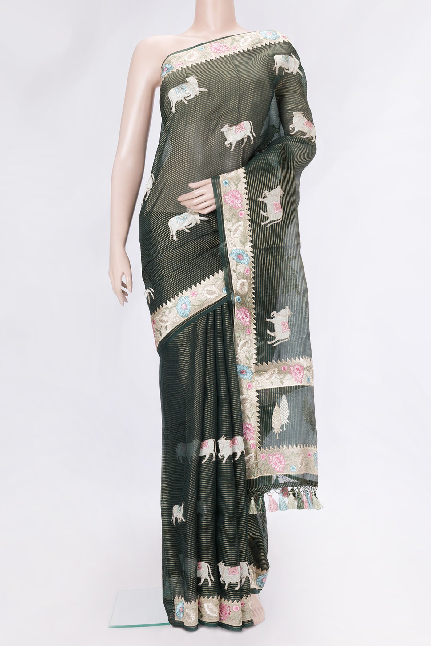 Bottle Green Dual Tone Organza Silk Saree with Stripes on the body and Fancy Border.  displayed on a mannequin