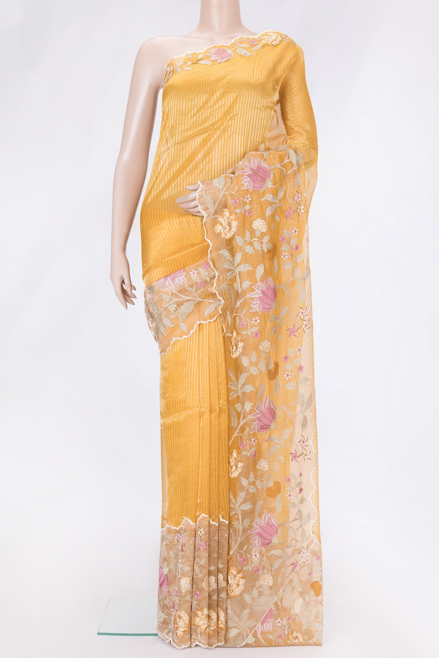Orange Dual Tone Organza Silk Saree with Embroidery on the body and Fancy Border.  displayed on a mannequin