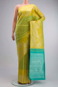 Green Kanchipuram Silk Saree with Jacquard design on the body and Zari Border displayed on a mannequin