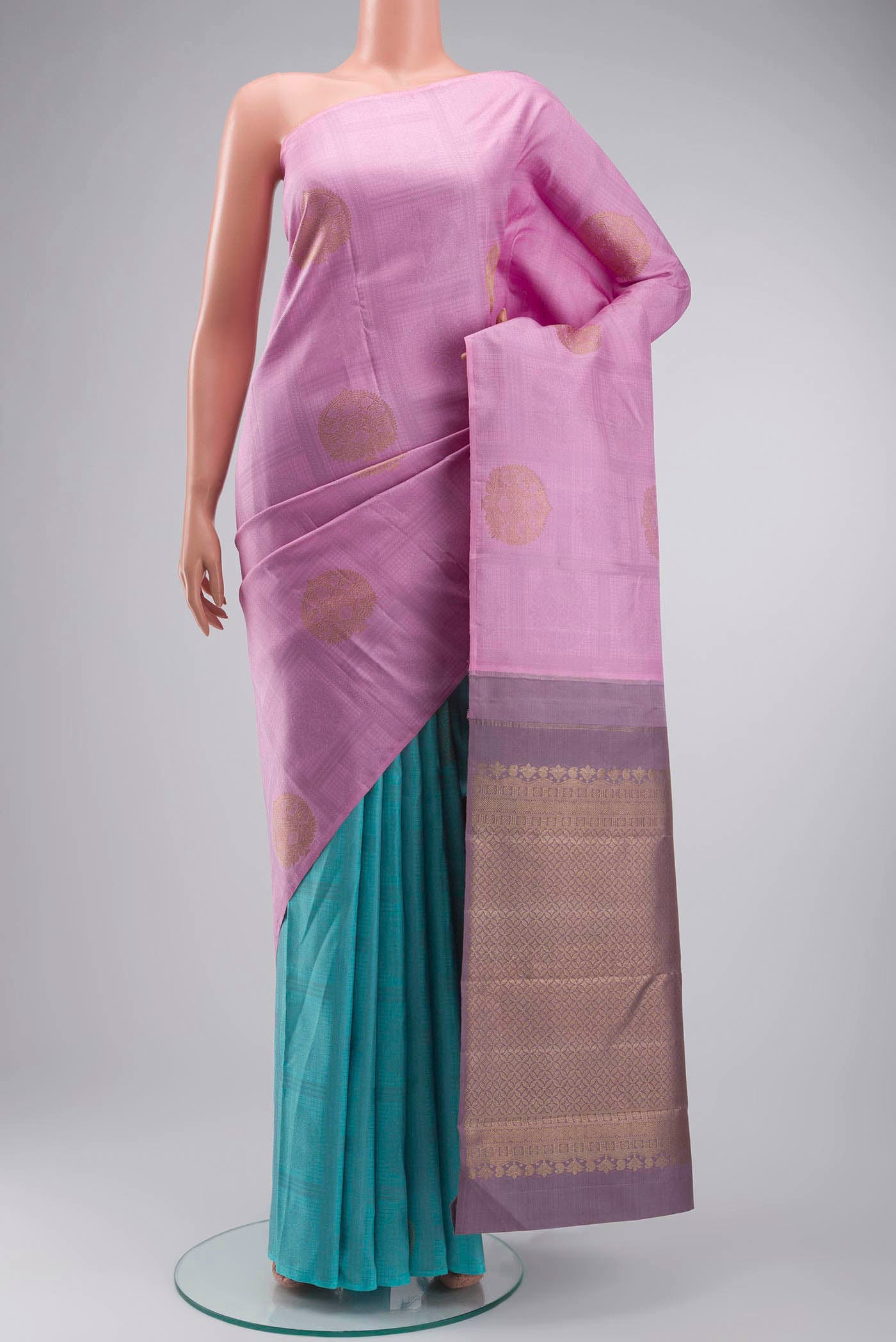 Pink Kanchipuram Silk Saree with Half And Half on the body and Without Border displayed on a mannequin