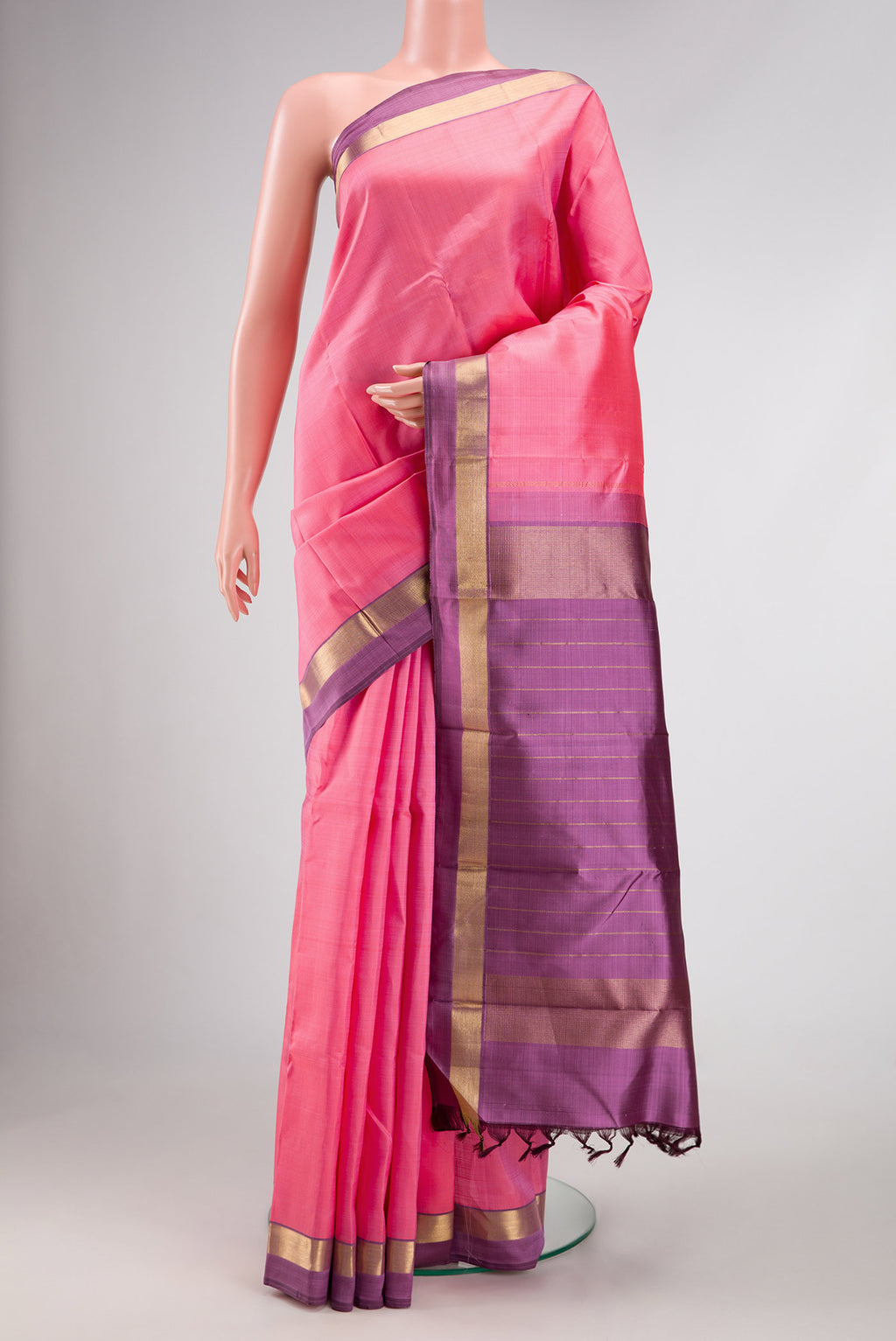 Pink Dual Tone Kanjivaram Silk Saree with Plain Body and Zari Border.  displayed on a mannequin