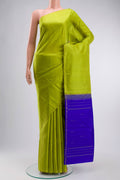 Green Kanchipuram Silk Saree with Zari Butta on the body and Zari Border displayed on a mannequin