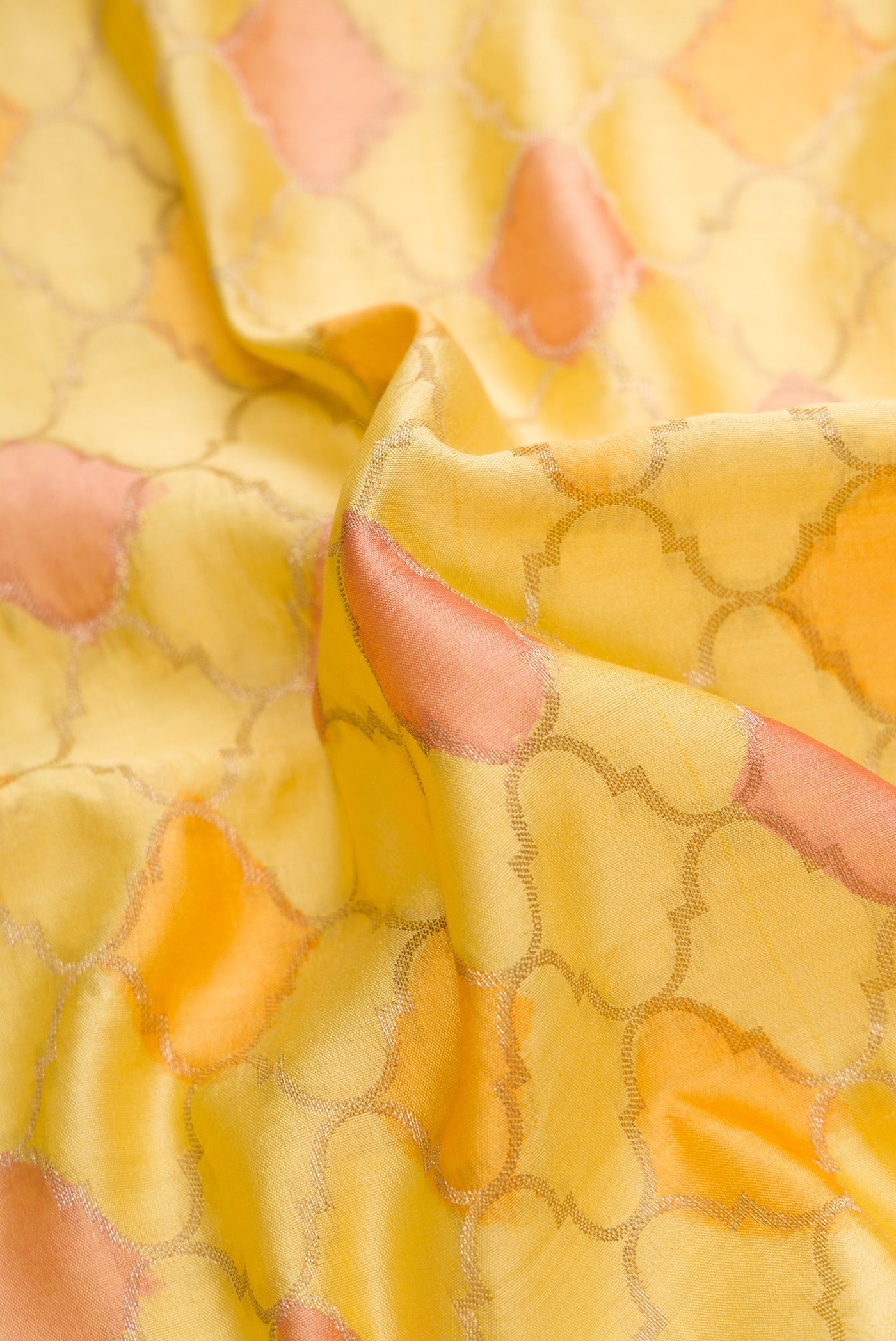 Close up of Lemon Yellow Dual Tone Tussar Silk Saree with Zari Brocade on the body and Fancy Border.  displaying folds
