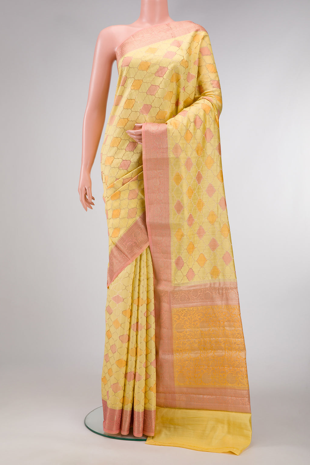 Lemon Yellow Dual Tone Tussar Silk Saree with Zari Brocade on the body and Fancy Border.  displayed on a mannequin