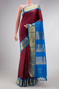 Pure Silk Pure Zari Maroon Dual Tone Kanchipuram Nine Yards Saree with Stripes on the body and Zari Border.  displayed on a mannequin