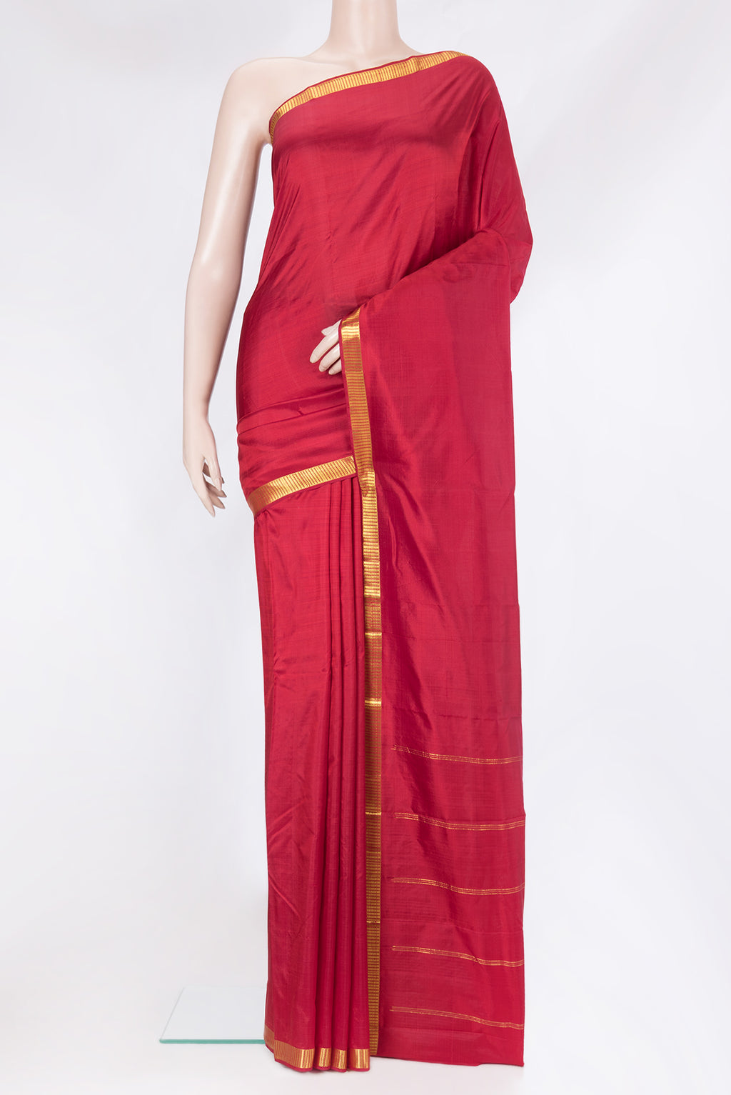 Maroon Kanchipuram Silk Saree with Plain Body and Zari Border.  displayed on a mannequin
