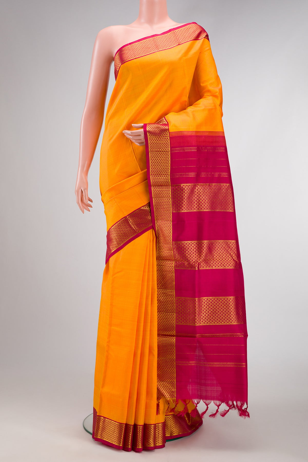 Orange Dual Tone Kanjivaram Silk Nine Yards Saree with Plain Body and Zari Border.  displayed on a mannequin
