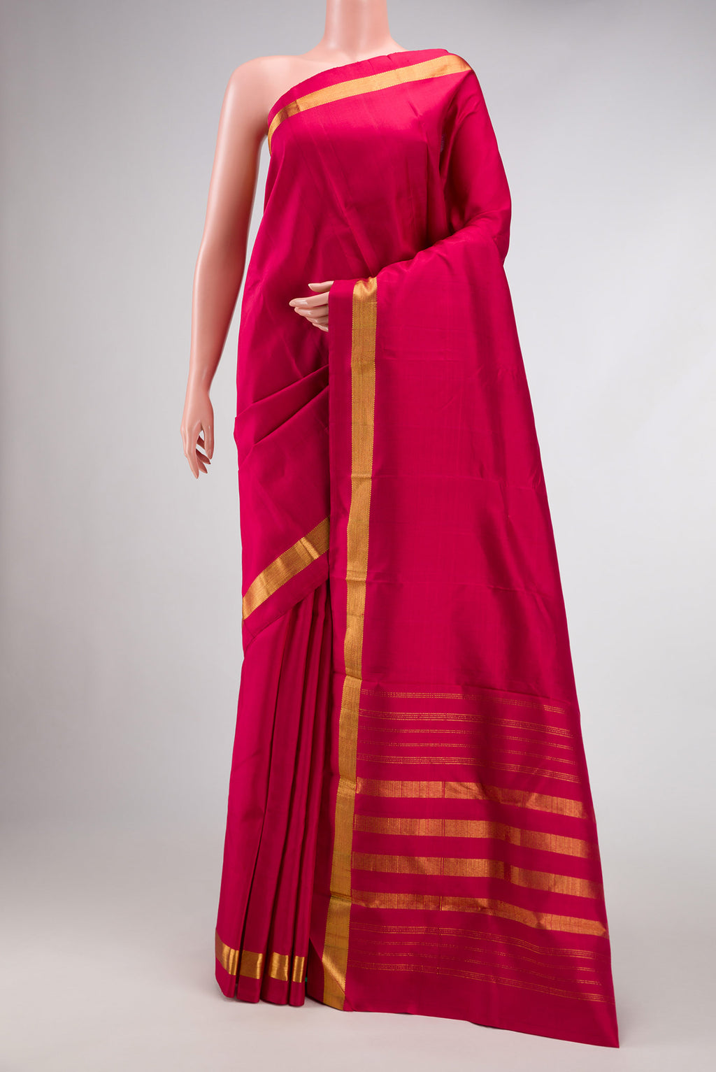 Maroon Dual Tone Kanjivaram Silk Saree with Plain Body and Zari Border.  displayed on a mannequin