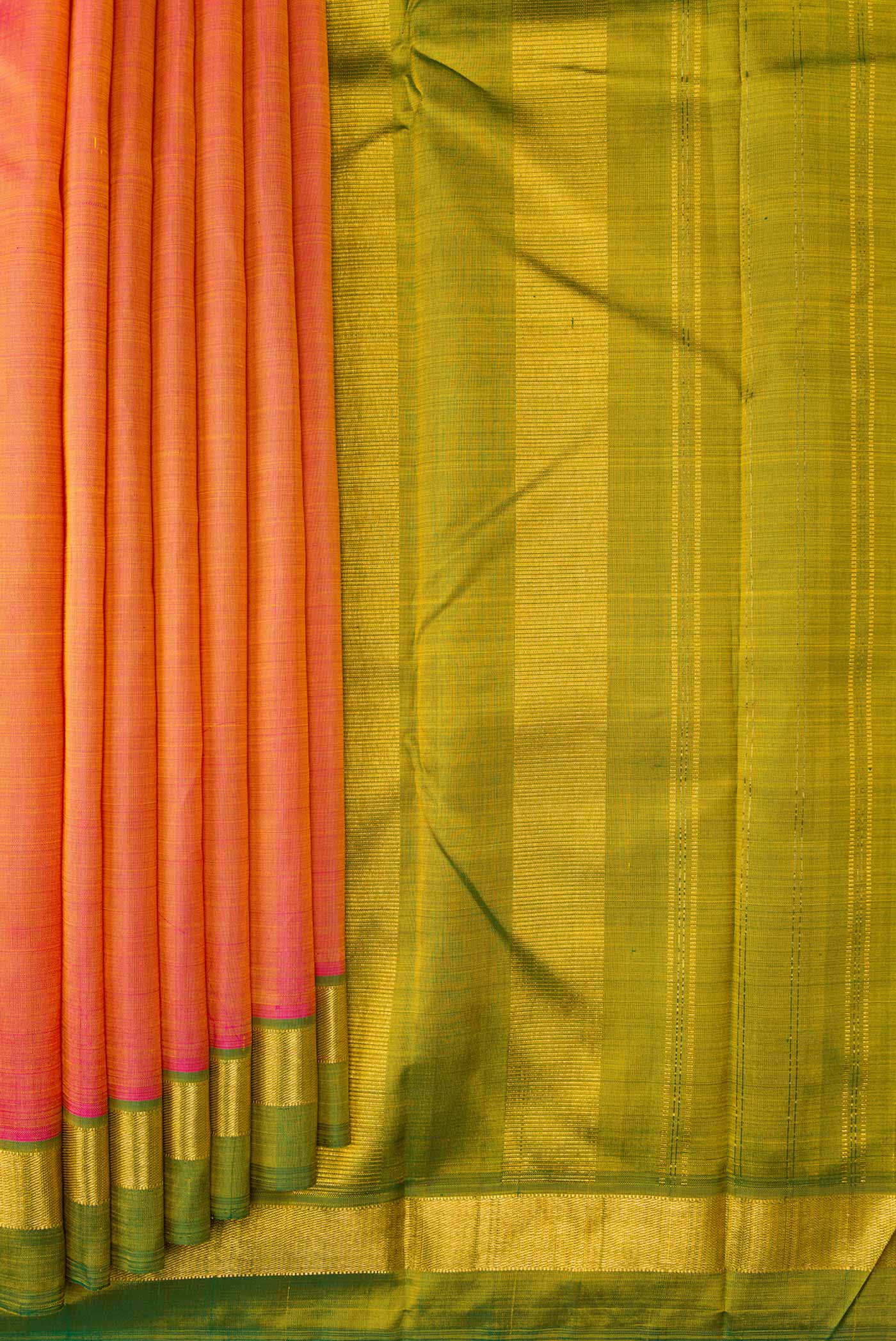 Pleats and pallu of Coral Dual Tone Kanjivaram Silk Saree with Plain Body and Zari Border. 