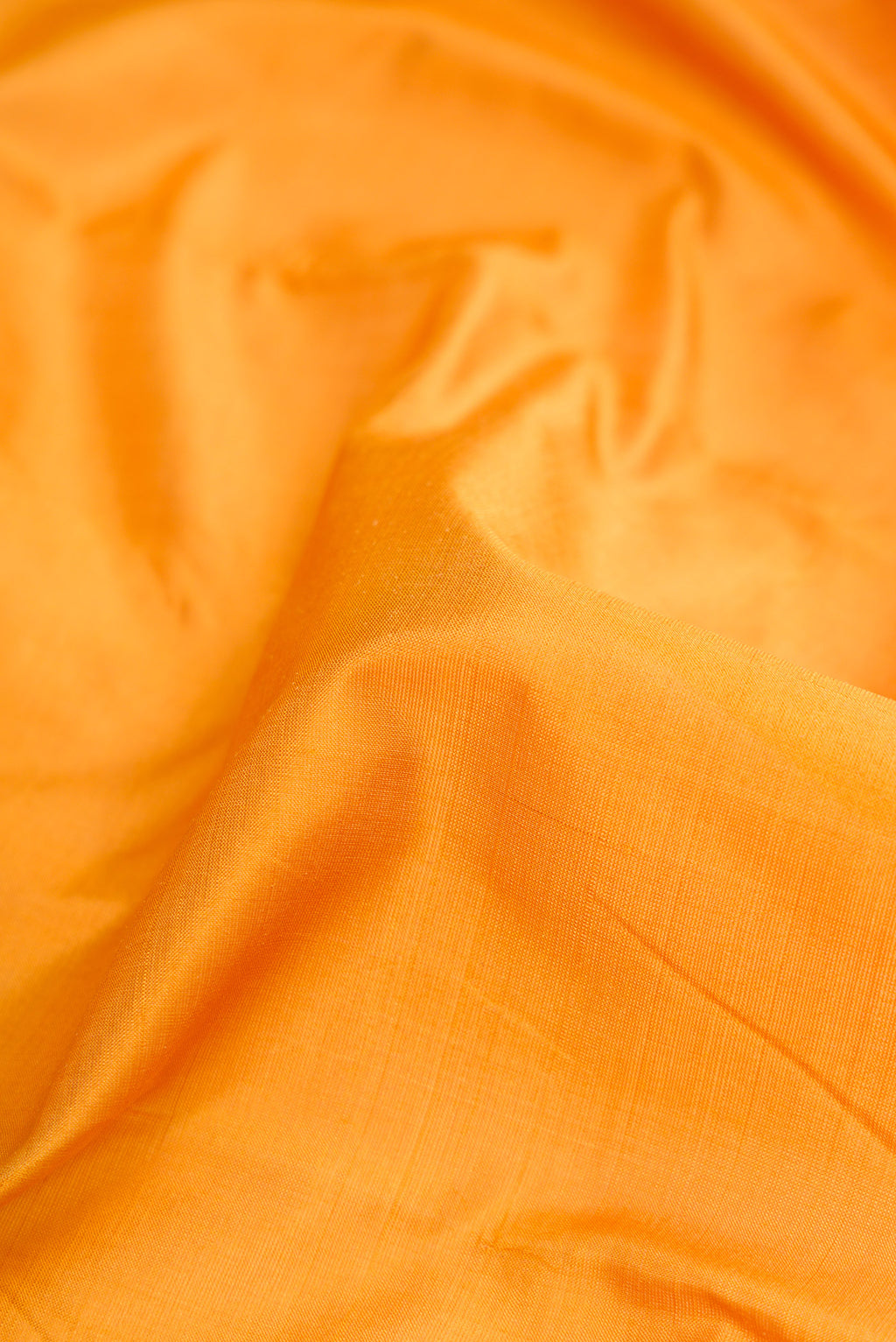 Close up of Yellow Dual Tone Kanchipuram Silk Nine Yards Saree with Thread Butta on the body and Zari And Thread Border.  displaying folds
