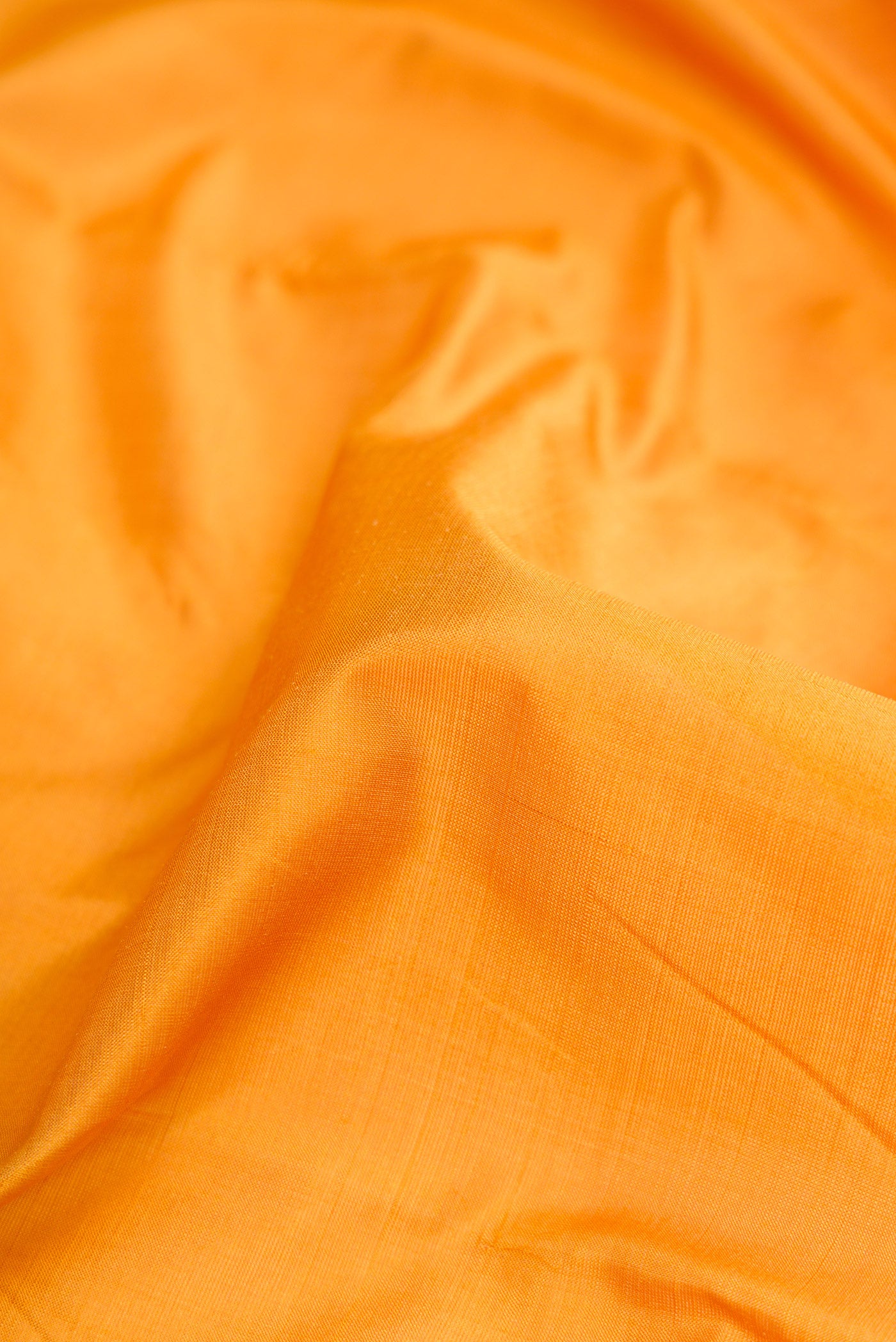 Close up of Yellow Dual Tone Kanchipuram Silk Nine Yards Saree with Thread Butta on the body and Zari And Thread Border.  displaying folds