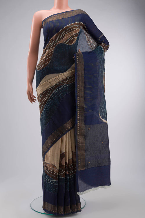 Beige Tussar Silk Saree with Embroidery on the body and Zari Border displayed on a mannequin