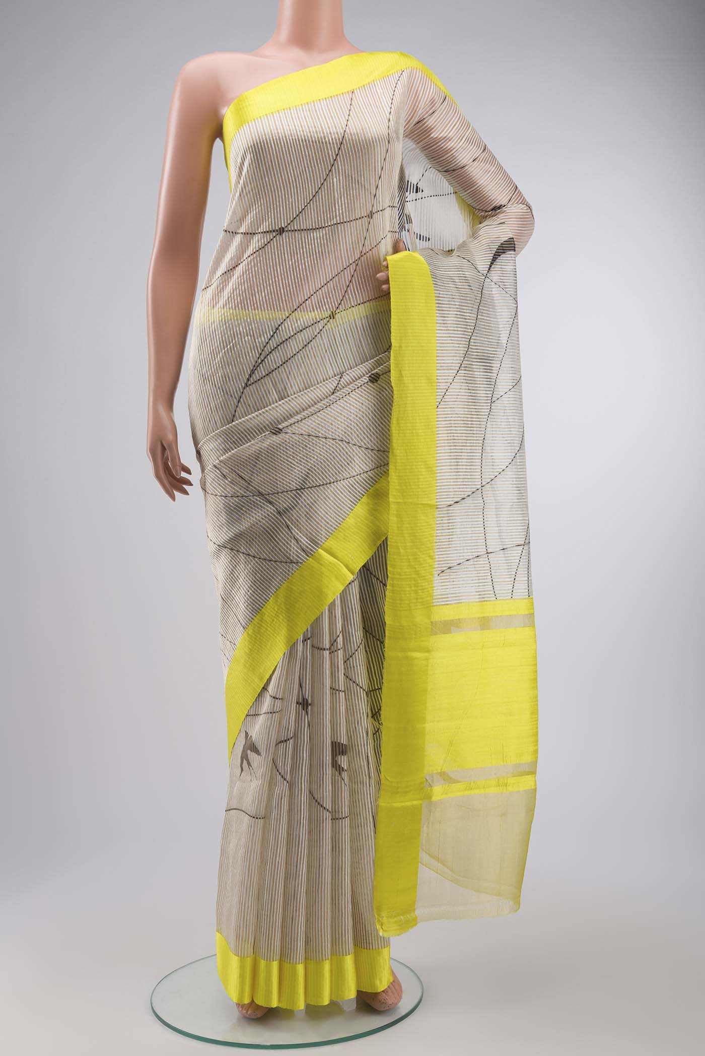 Off White Kora Silk Saree with Stripes on the body and Zari Border displayed on a mannequin