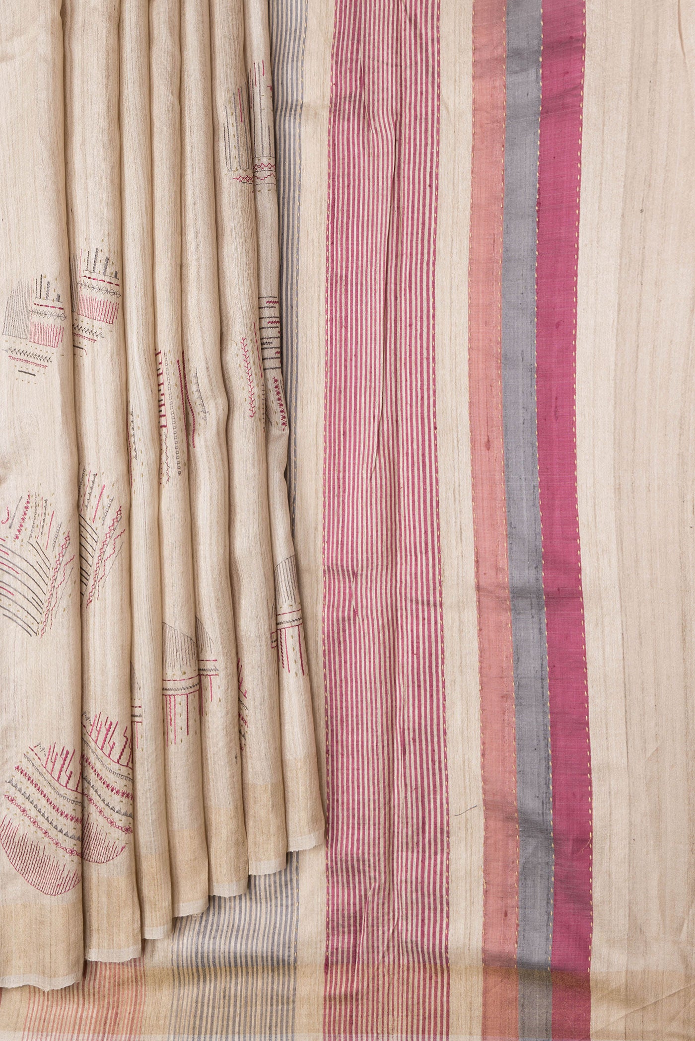 Pleats and pallu of Beige Dual Tone Tussar Silk Saree with Thread Butta on the body and Zari Border. 