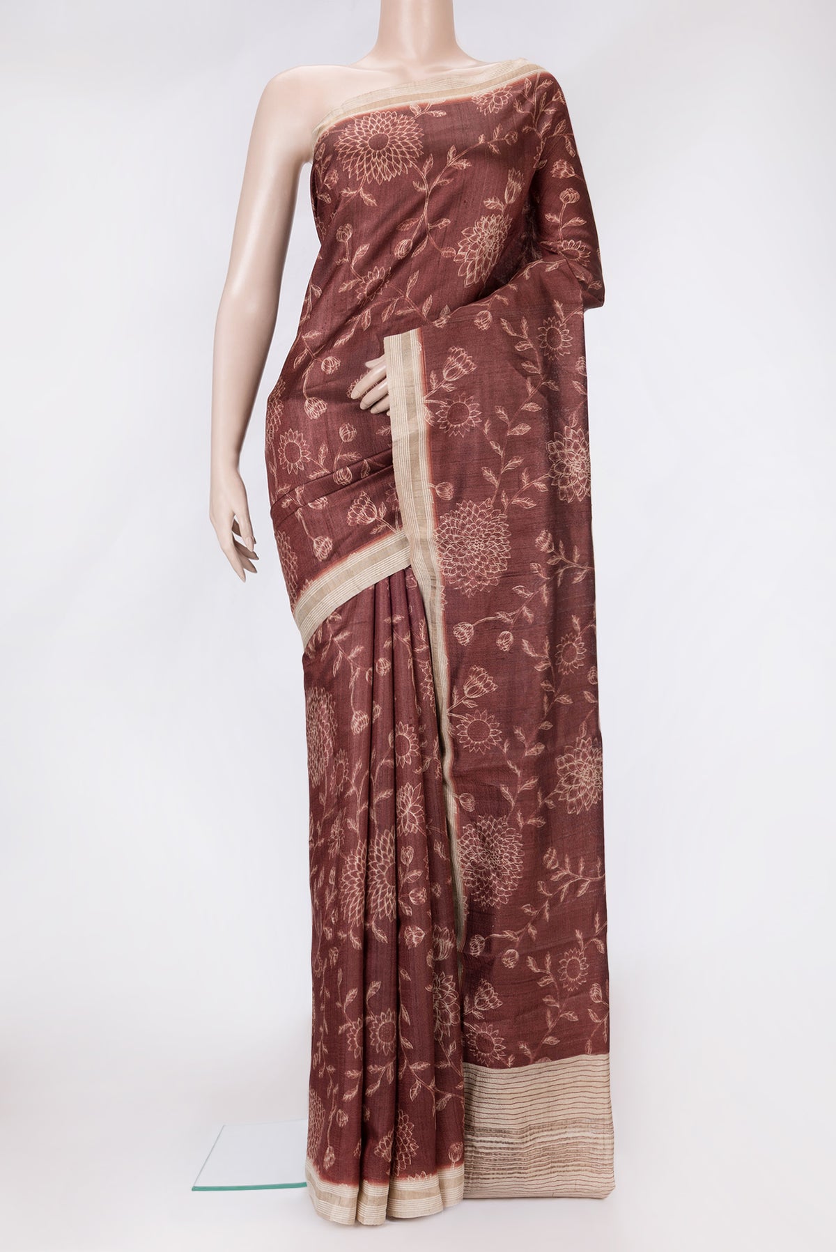Maroon Dual Tone Tussar Silk Saree with Printed design on the body and Zari Border.  displayed on a mannequin