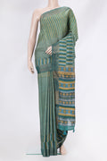 Mehandi Green Tussar Silk Saree with Embroidery on the body and Zari Border.  displayed on a mannequin