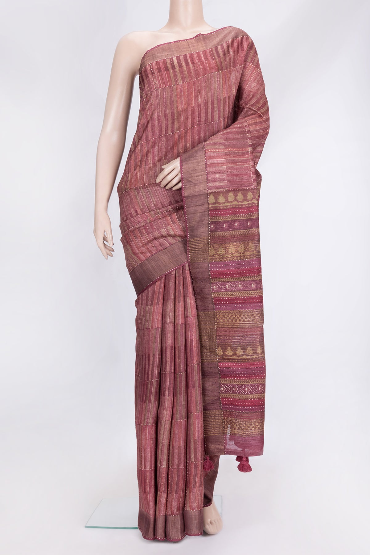 Magenta Dual Tone Tussar Silk Saree with Embroidery on the body and Zari Border.  displayed on a mannequin