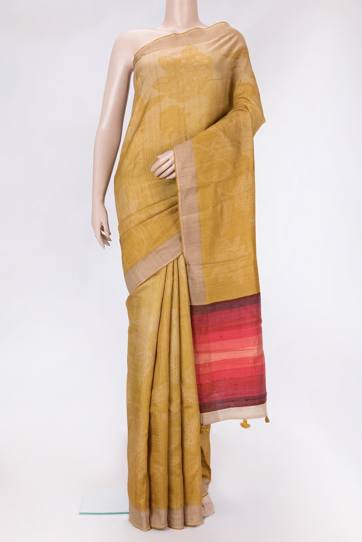Mustard Dual Tone Tussar Silk Saree with Printed design on the body and Embroidery Border.  displayed on a mannequin