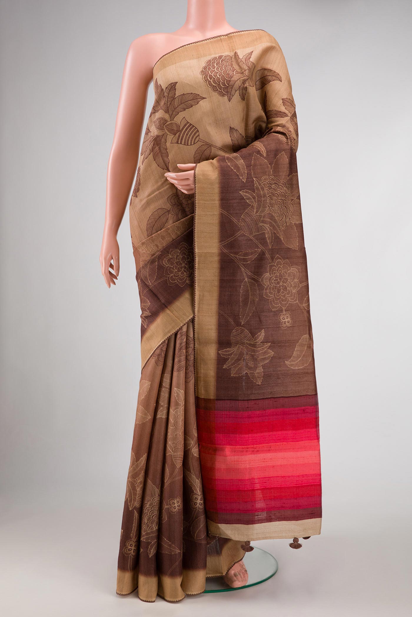Brown Dual Tone Tussar Silk Saree with Printed design on the body and Embroidery Border.  displayed on a mannequin