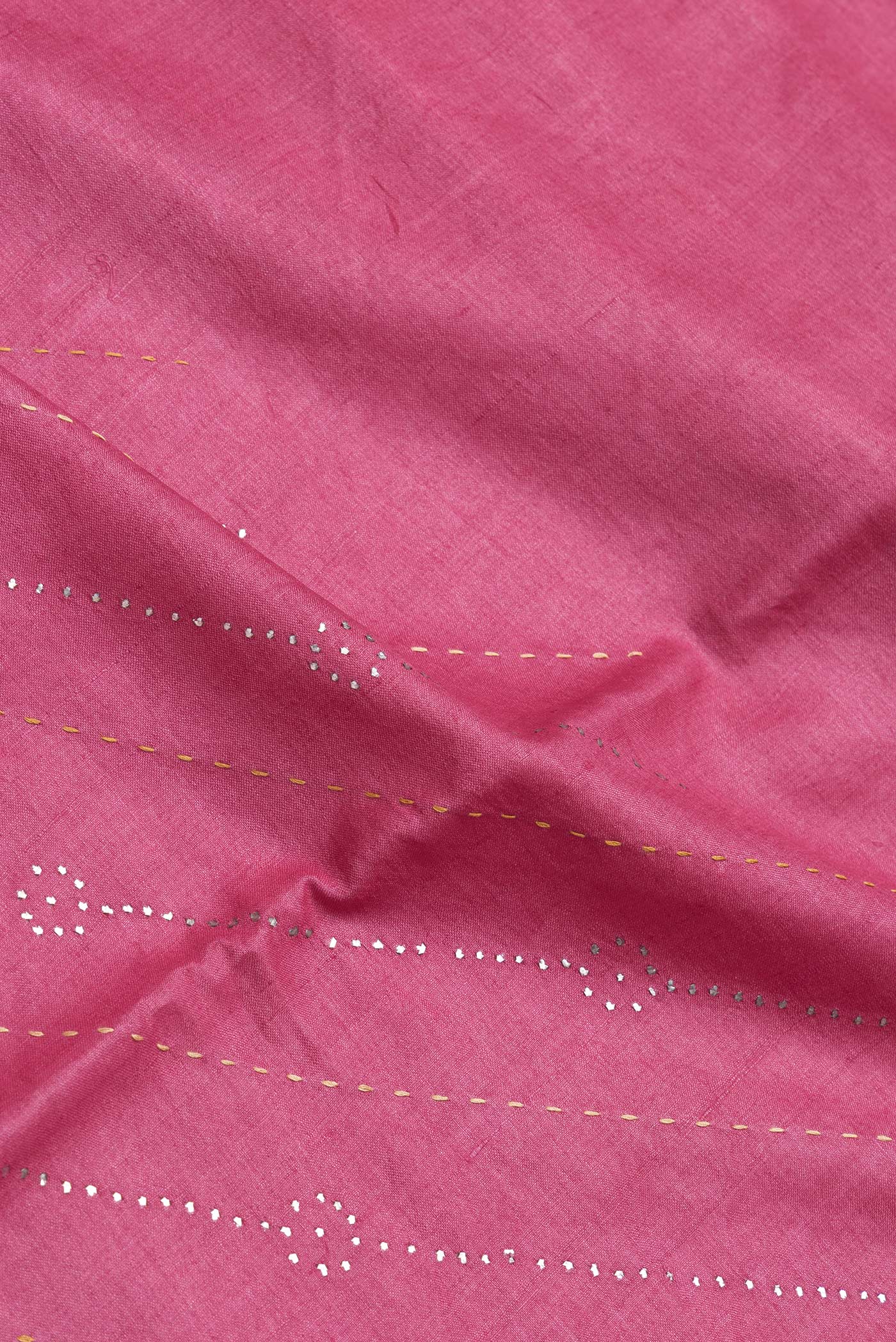 Close up of Pink Dual Tone Tussar Silk Saree with Embroidery on the body and Embroidery Border.  displaying folds