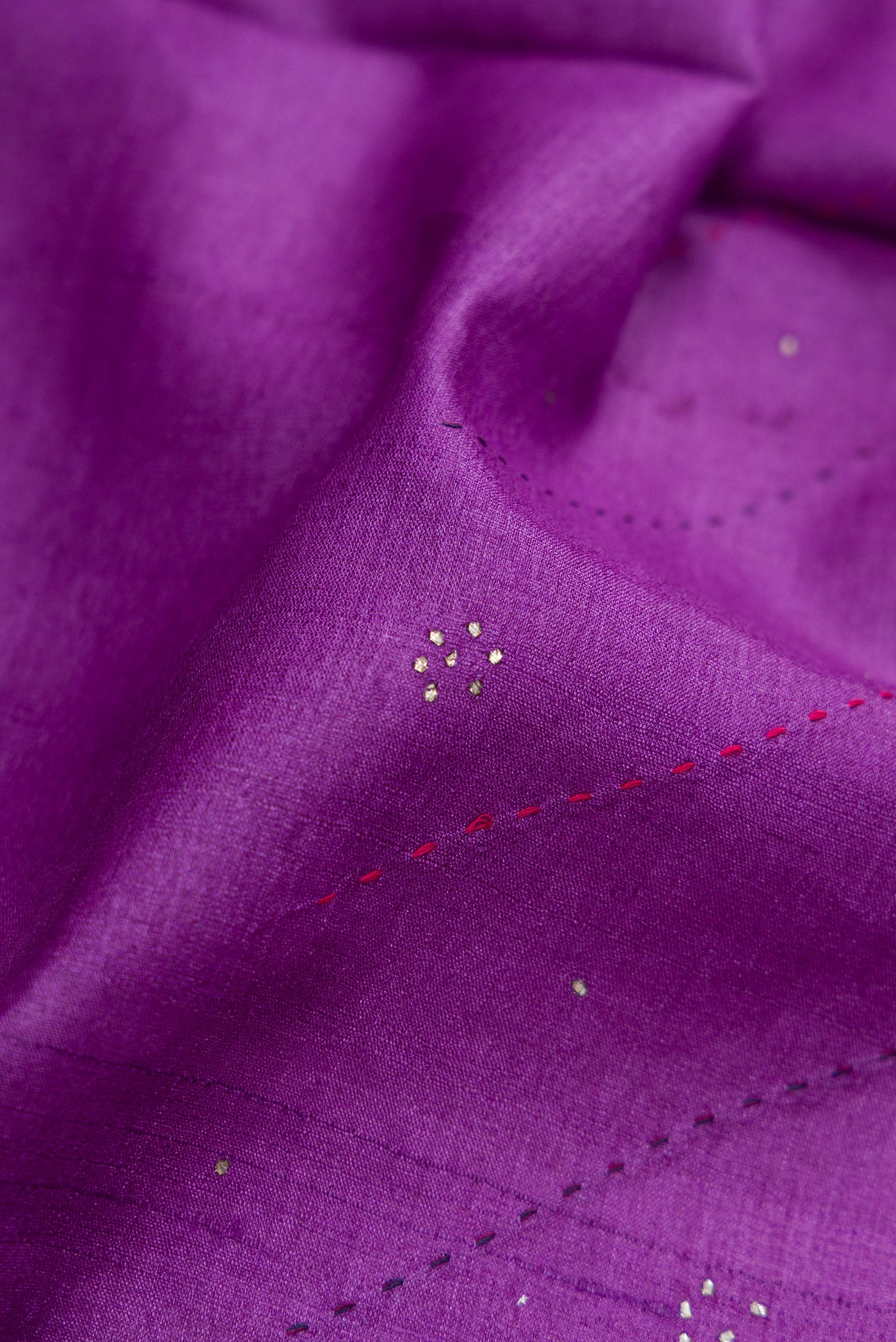 Close up of Purple Dual Tone Tussar Silk Saree with Embroidery on the body and Embroidery Border.  displaying folds