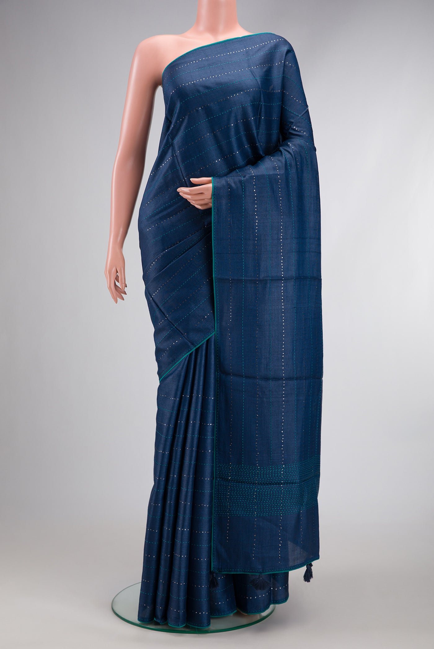 Navy Blue Dual Tone Tussar Silk Saree with Embroidery on the body and Embroidery Border.  displayed on a mannequin