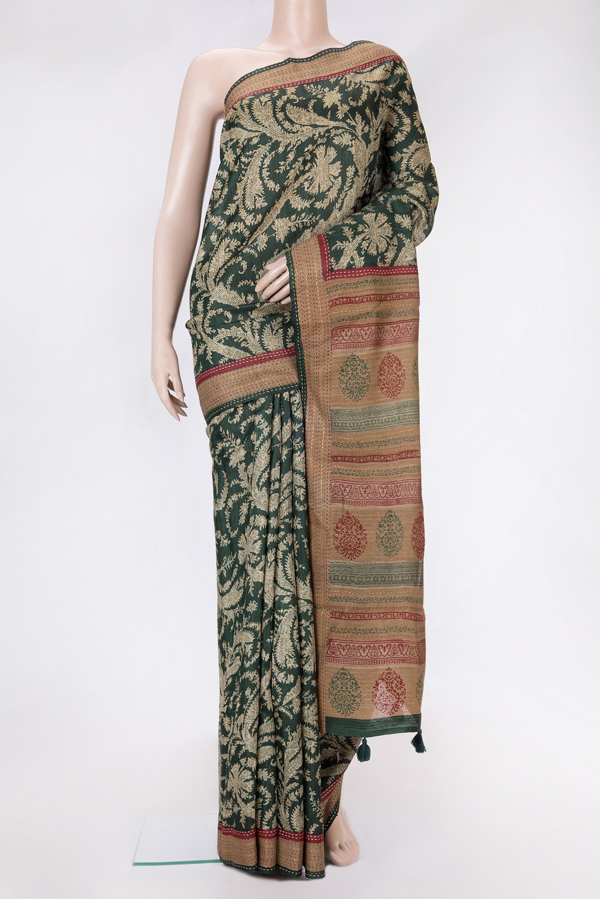 Bottle Green Dual Tone Tussar Silk Saree with Printed design on the body and Embroidery Border.  displayed on a mannequin