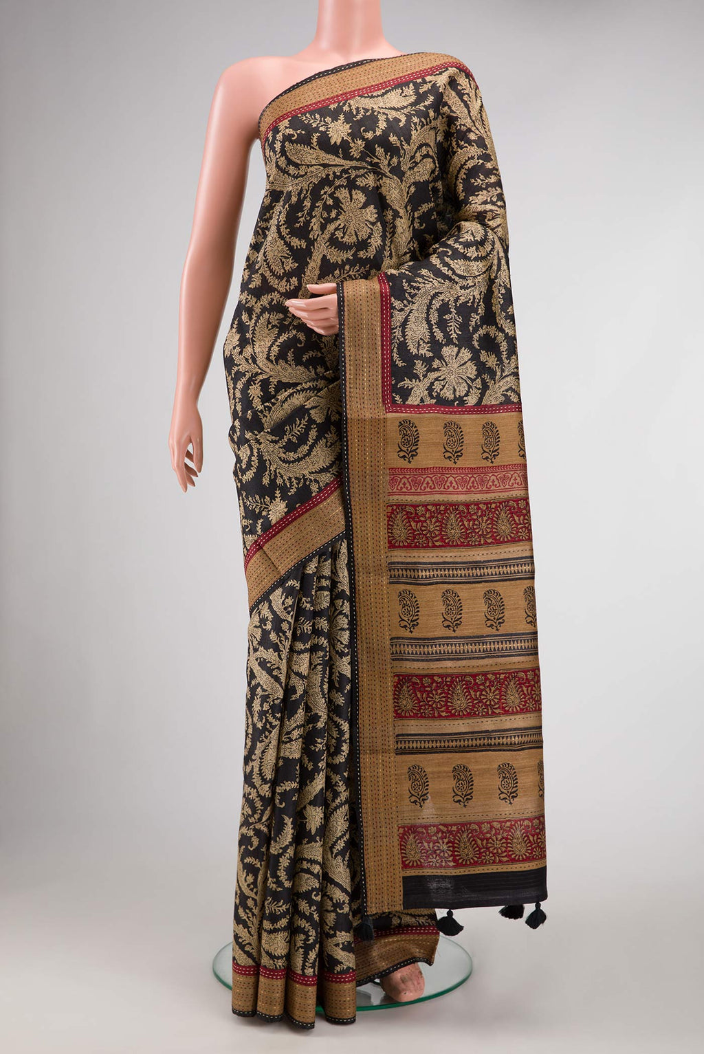 Black Dual Tone Tussar Silk Saree with Printed design on the body and Embroidery Border.  displayed on a mannequin