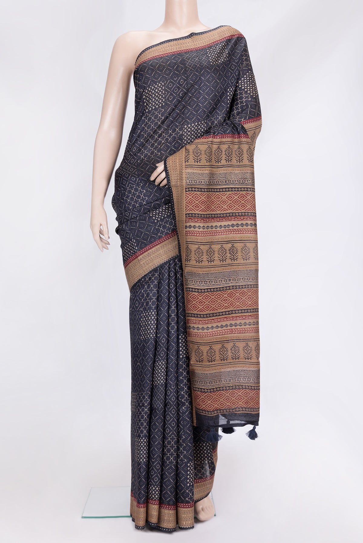 Navy Blue Dual Tone Tussar Silk Saree with Printed design on the body and Embroidery Border.  displayed on a mannequin