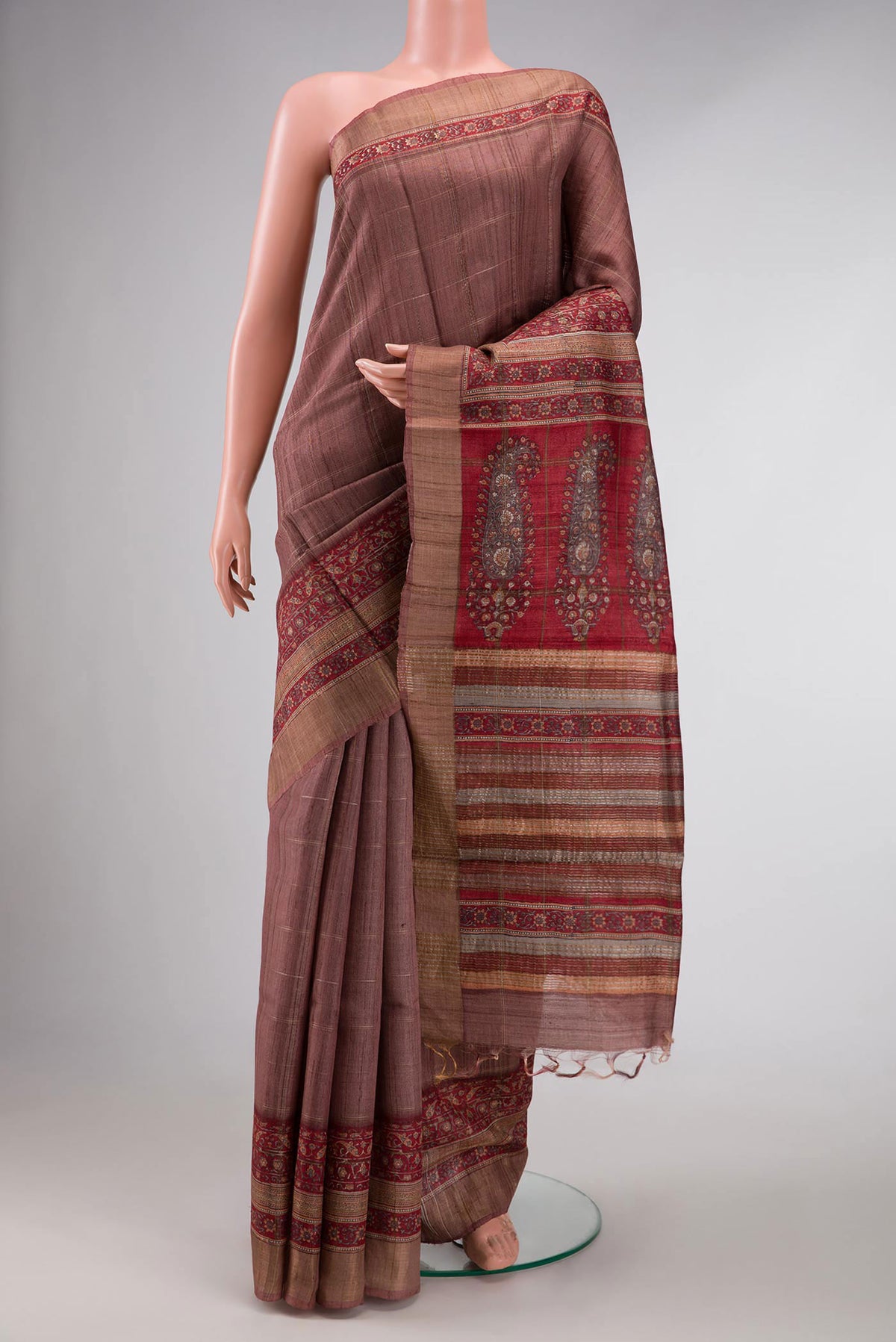 Bronze Dual Tone Tussar Silk Saree with Checked design on the body and Zari Border displayed on a mannequin