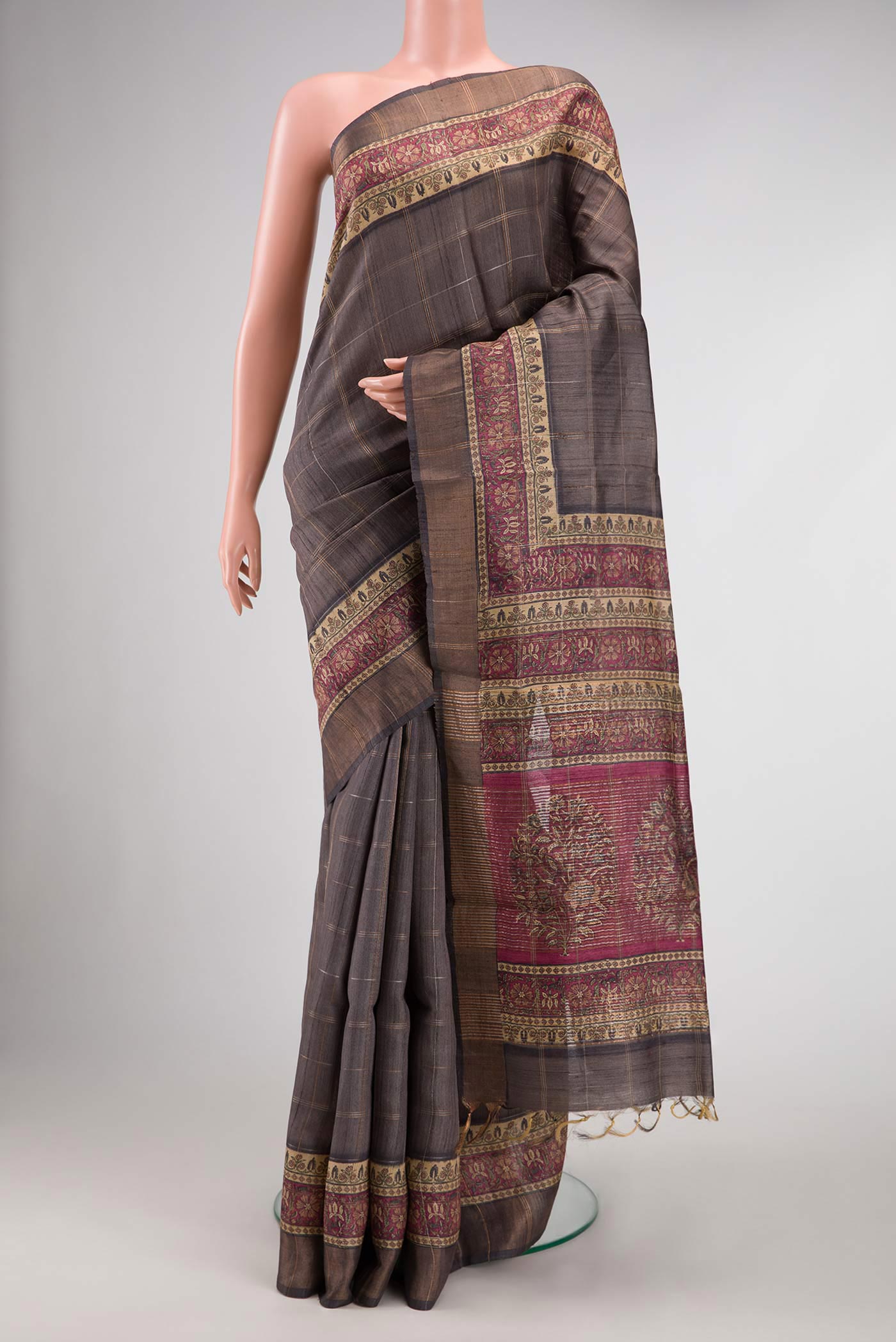 Grey Dual Tone Tussar Silk Saree with Checked design on the body and Fancy Border.  displayed on a mannequin