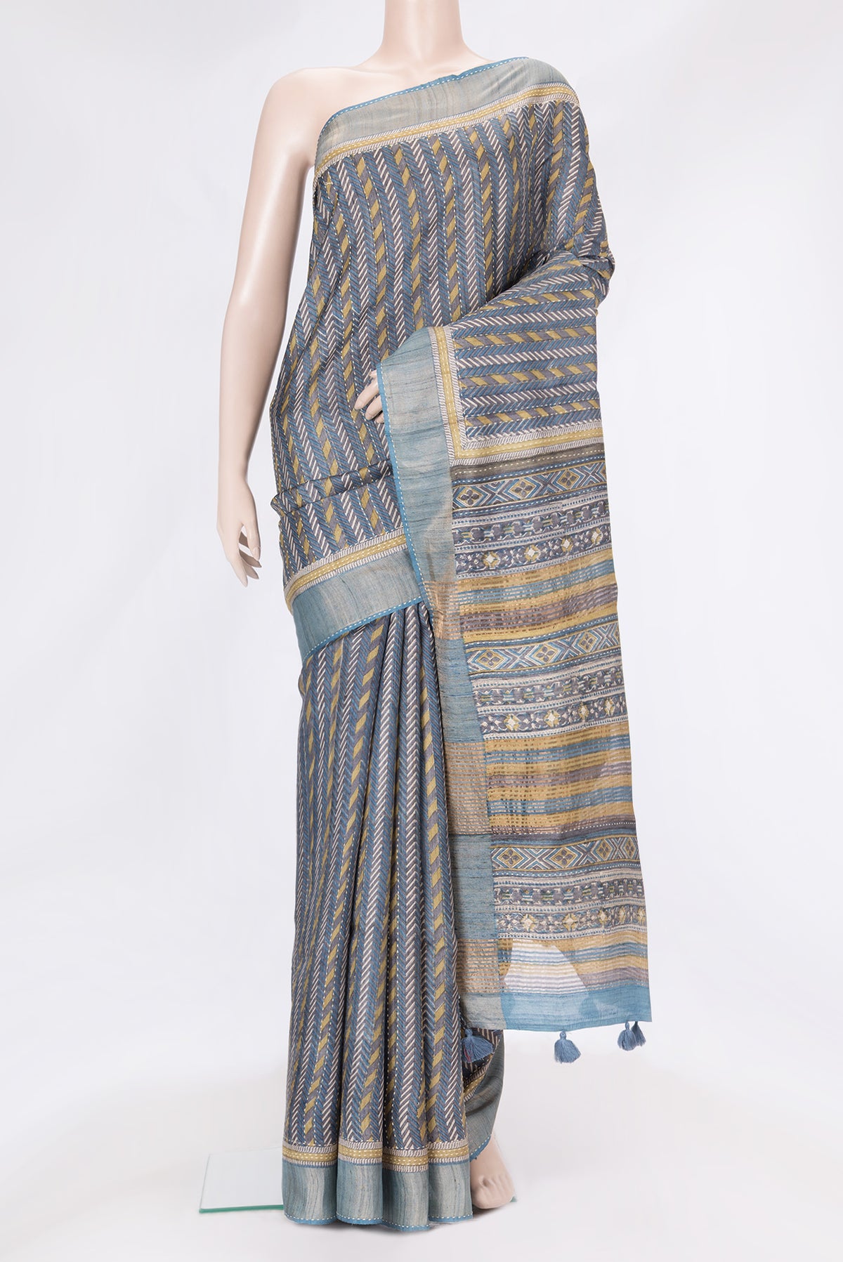 Navy Blue Dual Tone Tussar Silk Saree with Printed design on the body and Zari And Thread Border.  displayed on a mannequin