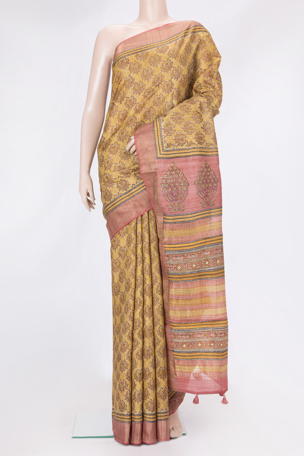 Mustard Dual Tone Tussar Silk Saree with Printed design on the body and Zari And Thread Border.  displayed on a mannequin