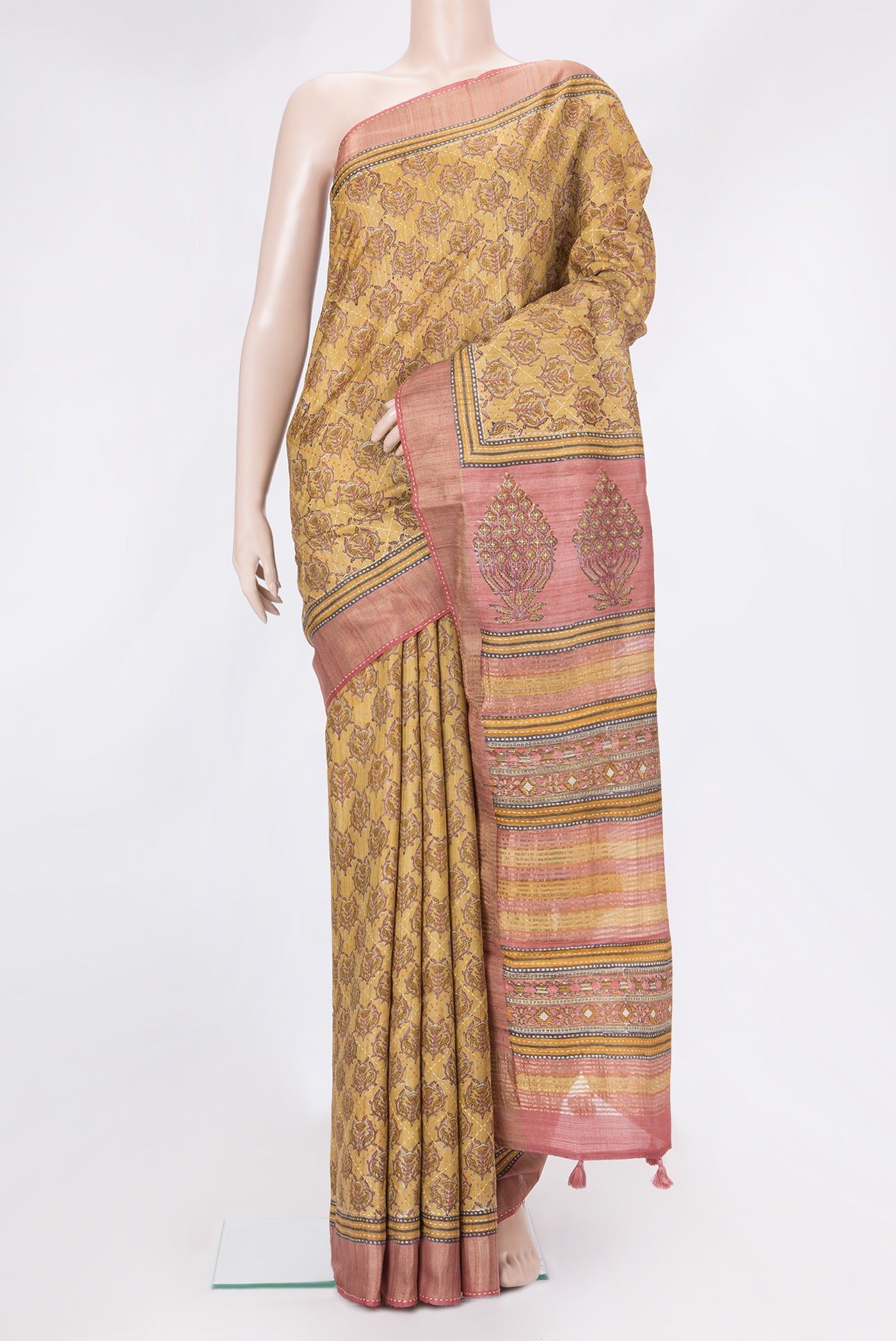 Mustard Dual Tone Tussar Silk Saree with Printed design on the body and Zari And Thread Border.  displayed on a mannequin