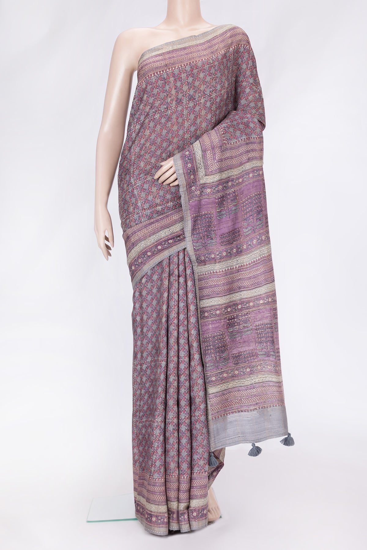 Grey Dual Tone Tussar Silk Saree with Printed design on the body and Printed Border.  displayed on a mannequin