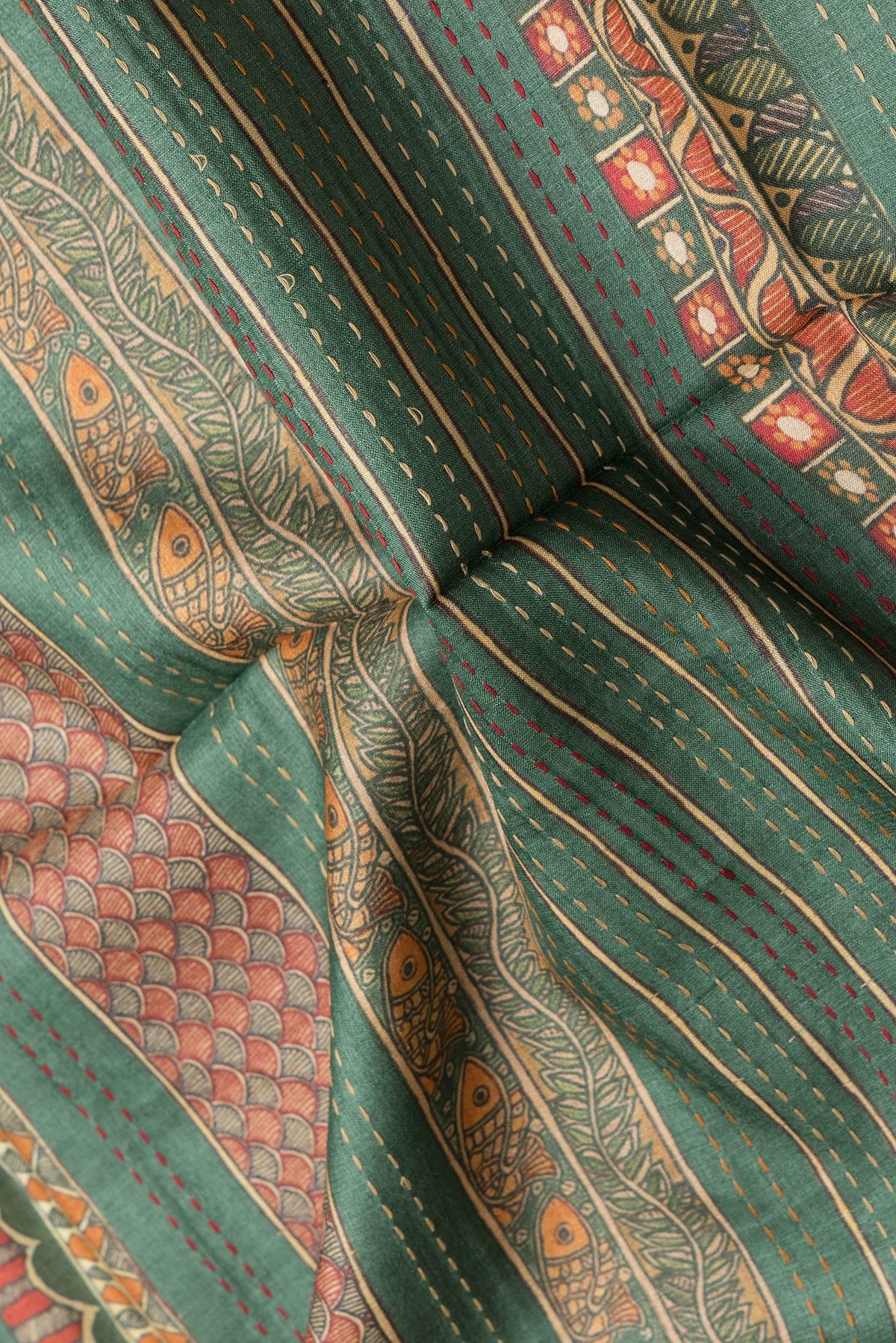 Close up of Green Dual Tone Tussar Silk Saree with Stripes on the body and Fancy Border.  displaying folds