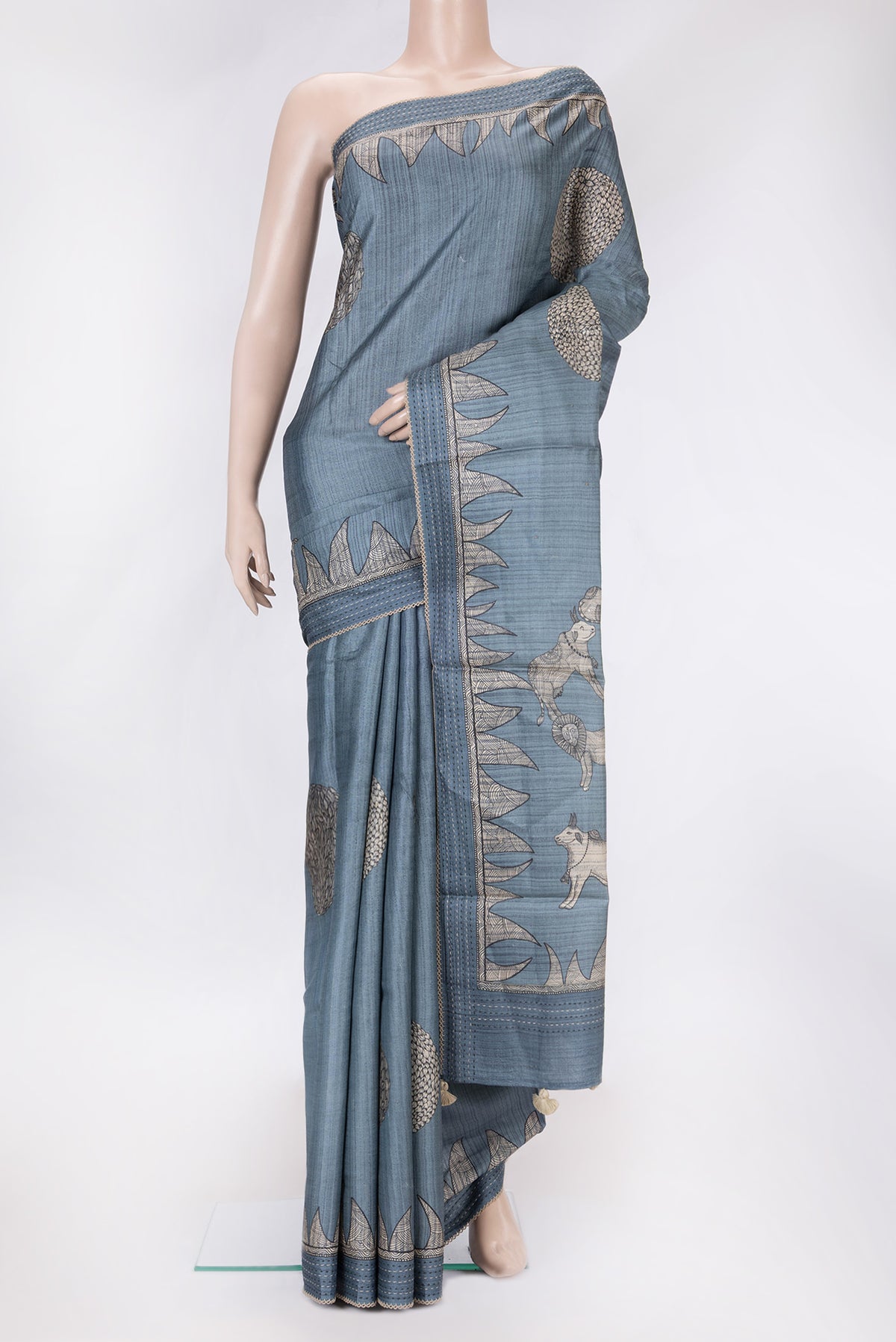 Grey Dual Tone Tussar Silk Saree with Printed design on the body and Embroidery Border.  displayed on a mannequin