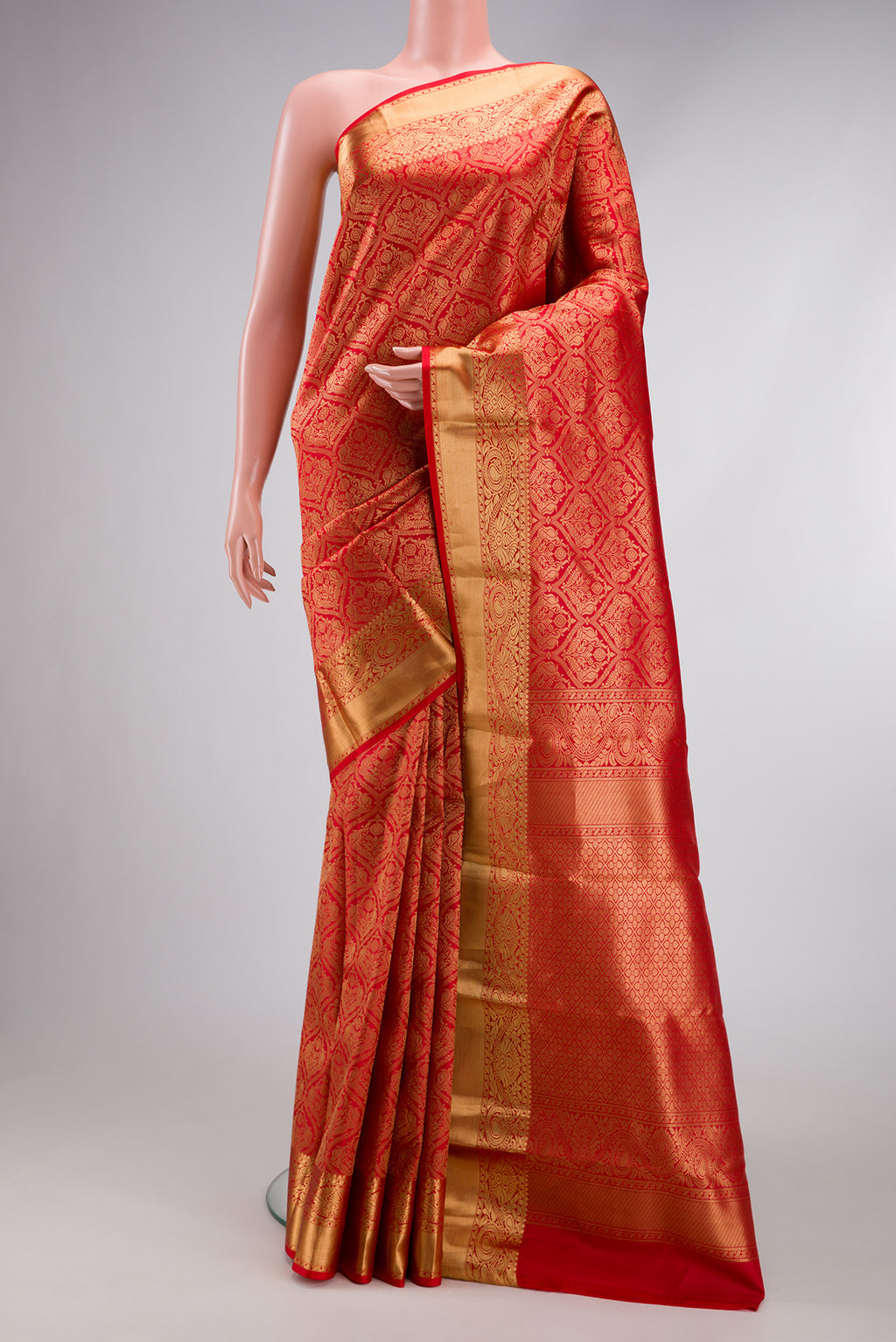 Red Kanchipuram Silk Saree with Zari Brocade on the body and Zari Border.  displayed on a mannequin
