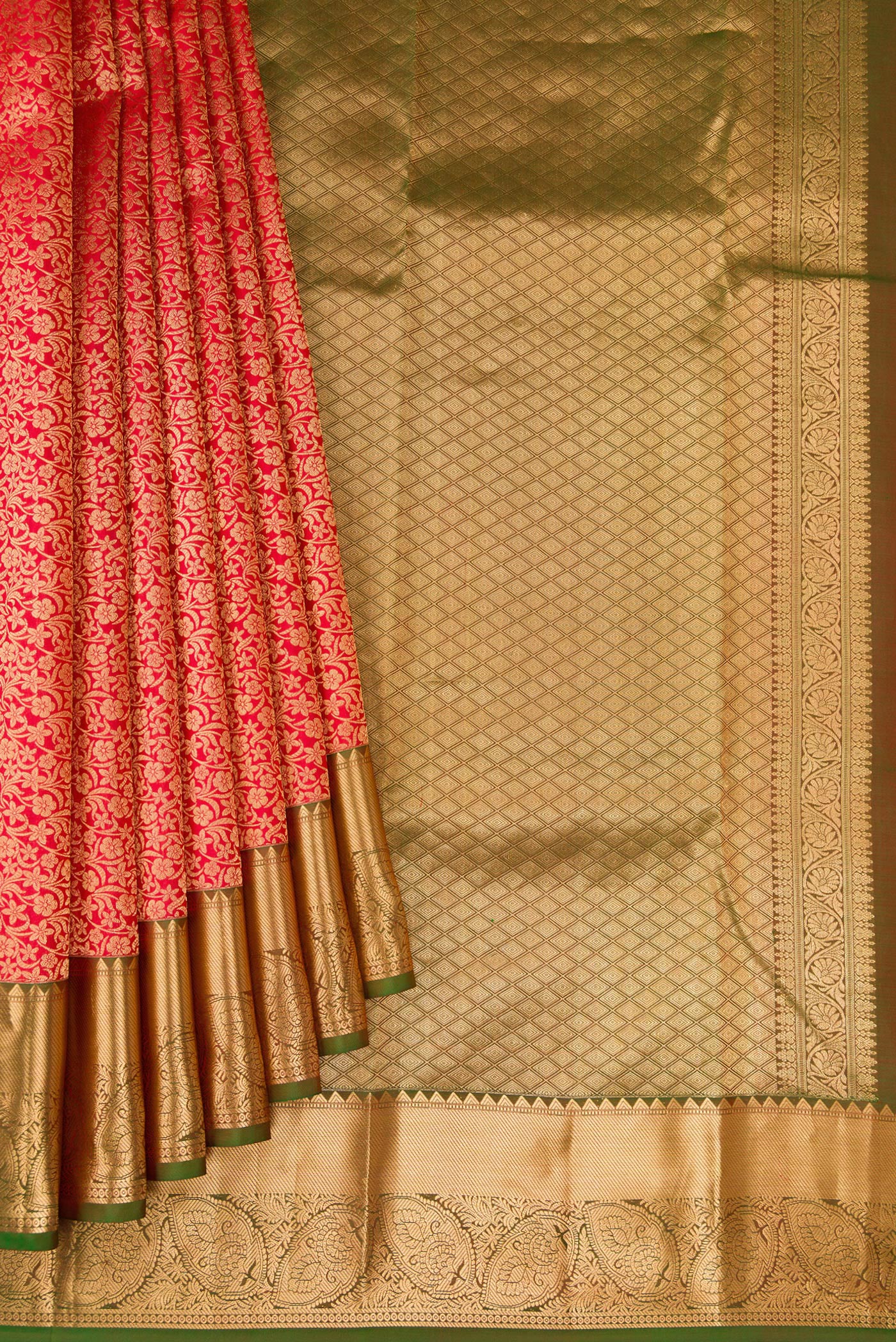 Pleats and pallu of Red Kanchipuram Silk Saree with Zari Brocade on the body and Zari Border. 