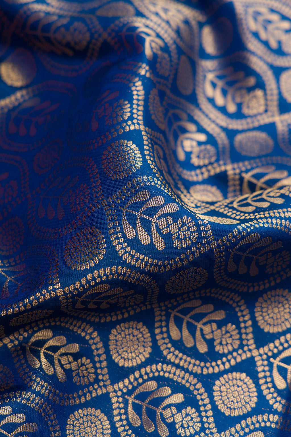 Close up of Peacock Blue Kanjivaram Silk Saree with Zari Brocade on the body and Zari Border.  displaying folds