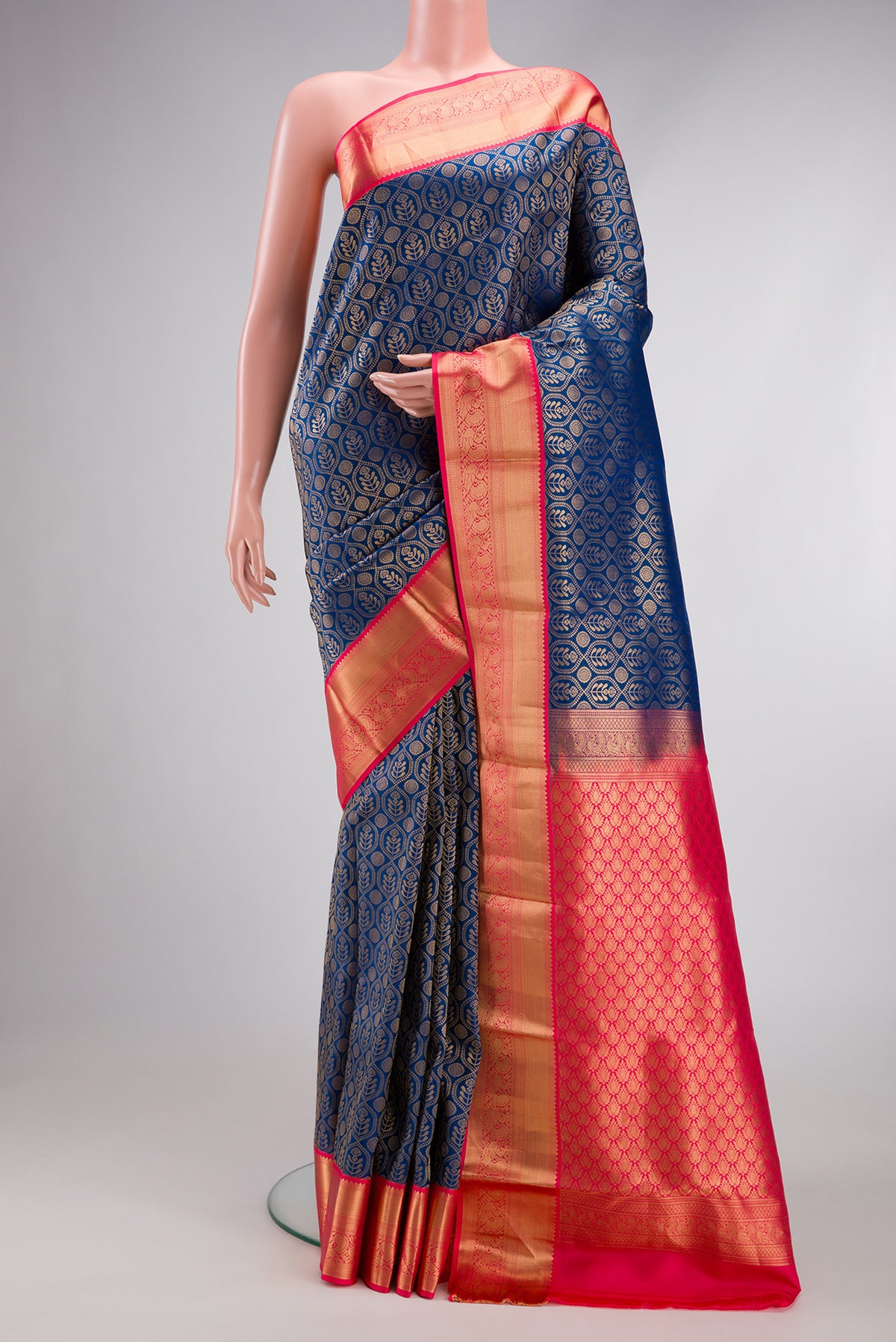 Peacock Blue Kanjivaram Silk Saree with Zari Brocade on the body and Zari Border.  displayed on a mannequin