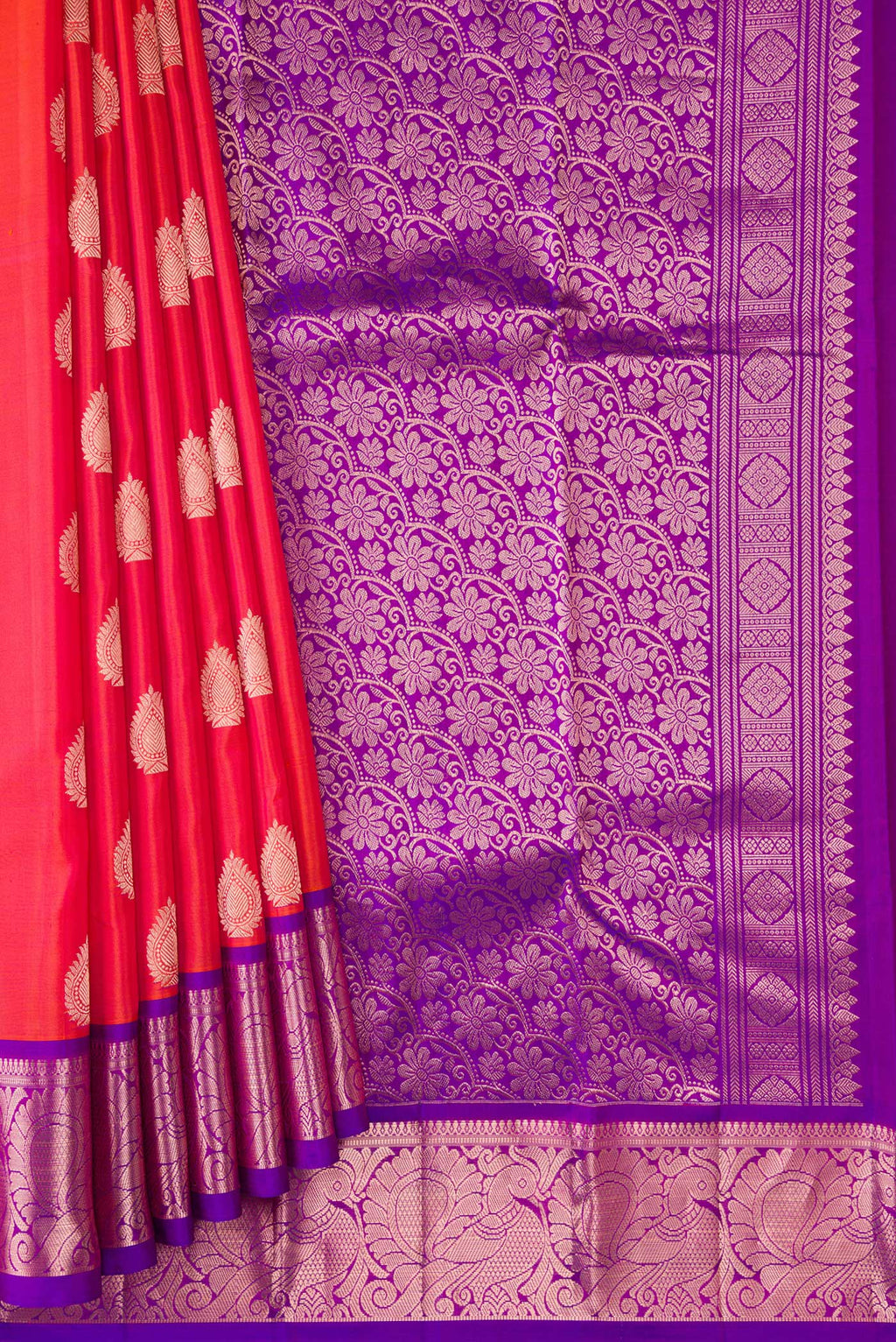 Pleats and pallu of Orange Dual Tone Kanjivaram Silk Saree with Zari Butta on the body and Zari Border. 