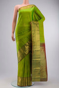 Green Kanchipuram Silk Saree with Zari Butta on the body and Zari Border displayed on a mannequin