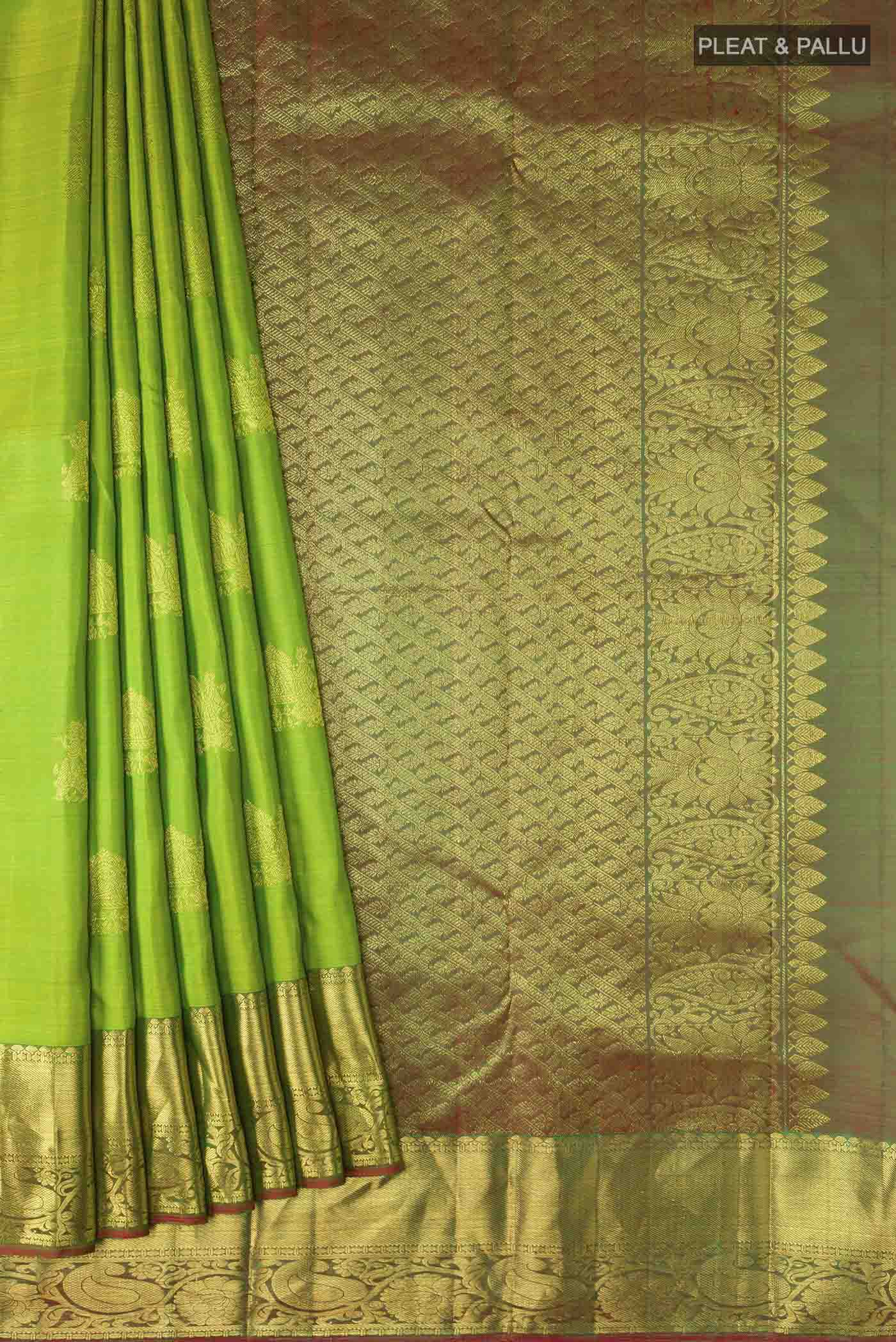 Pleats and pallu of Green Kanchipuram Silk Saree with Zari Butta on the body and Zari Border