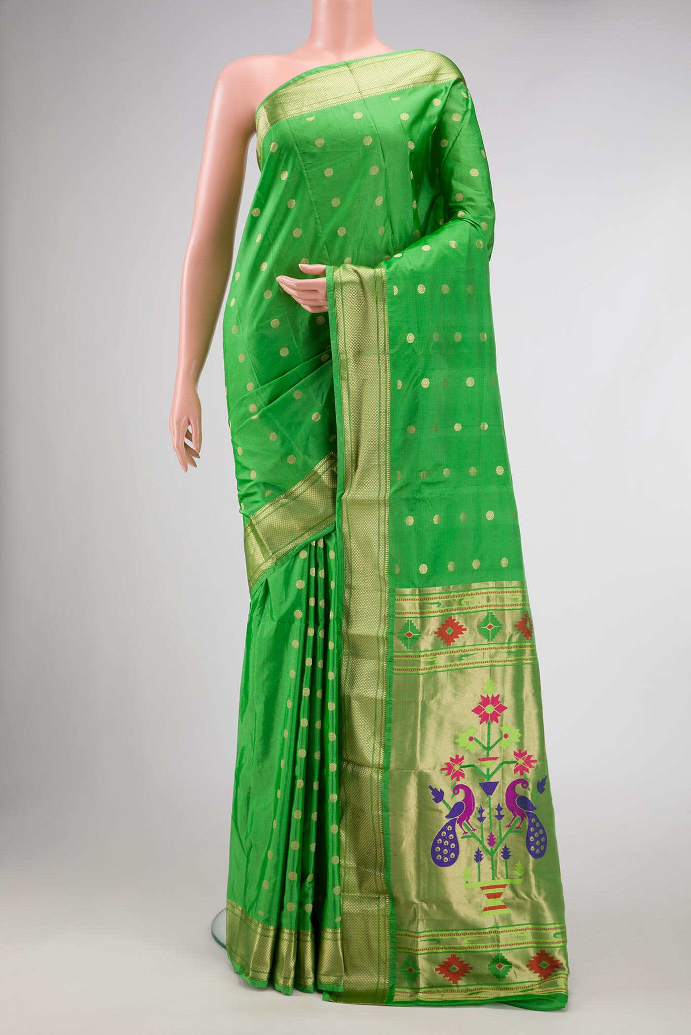 Green Blended Bangalore Silk Saree with Zari Butta on the body and Zari Border displayed on a mannequin